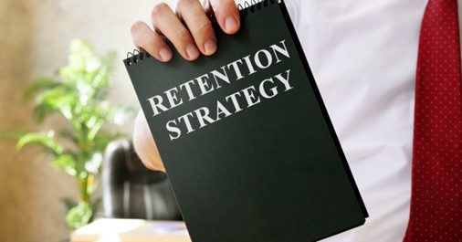 Man in white shirt holding a retention strategy folder