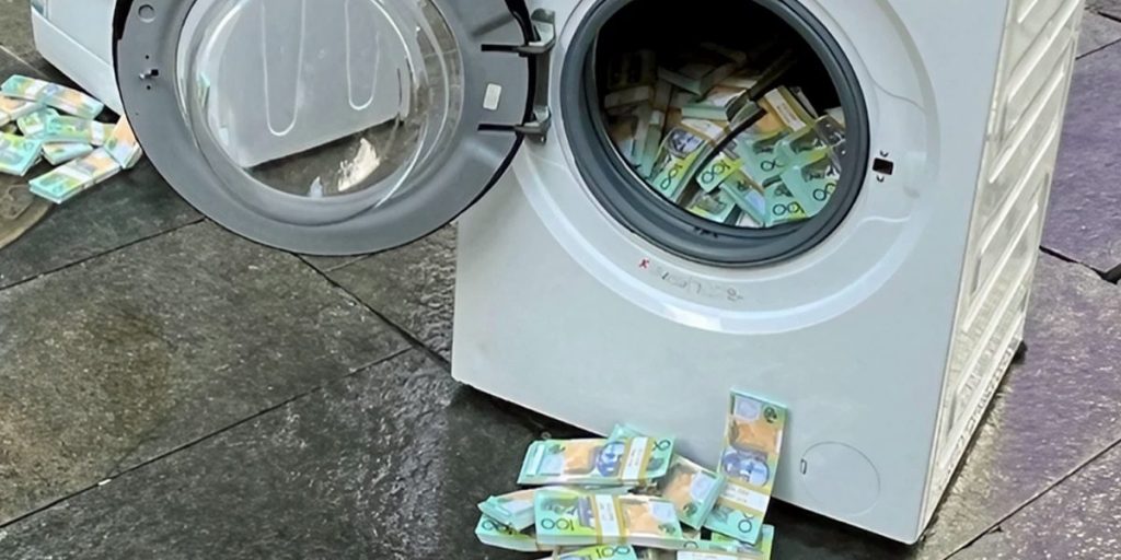 Dollar notes in and around a washing machine