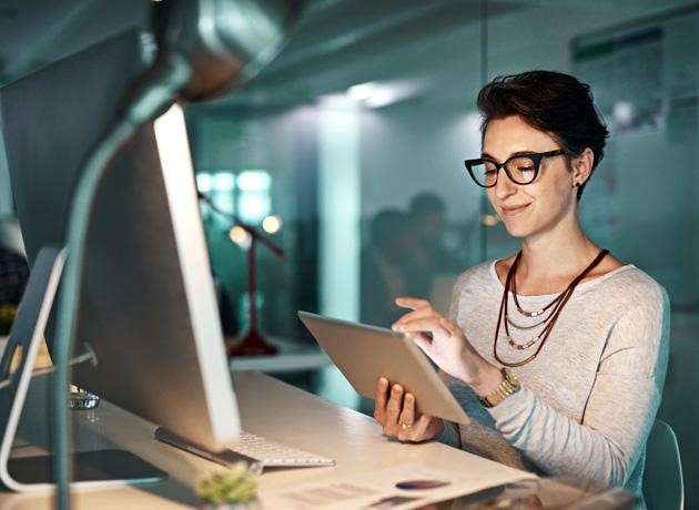 Hard work produces great workers. Shot of a young businesswoman working late at the office.